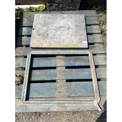 54 - A galvanised manhole cover and frame