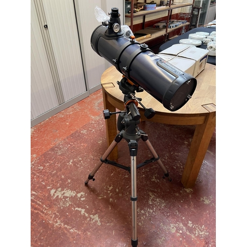 350 - A Celestron Astro Master 130 astrological telescope and stand