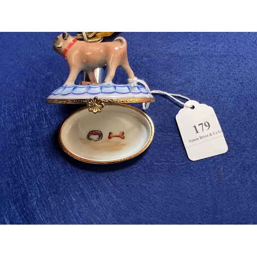 179 - A Limoges ceramic pill box modelled in the form of a pug dog the interior decorated with the dog's d... 