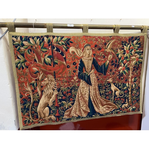 350 - An embroidered wall hanging depicting a maiden, a raptor and other animals