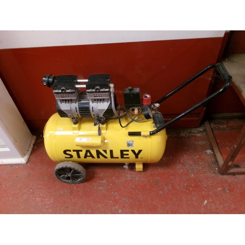 407 - A Stanley twin cylinder portable workshop compressor