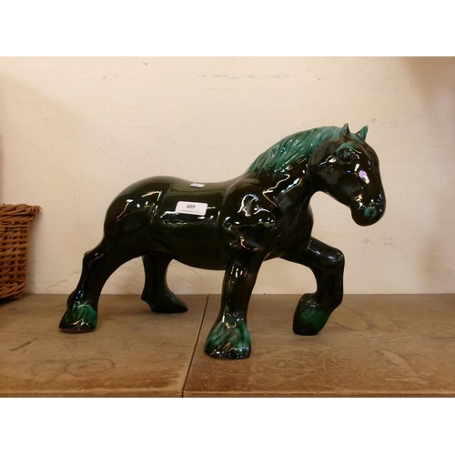 409 - A glazed ceramic model of a work horse