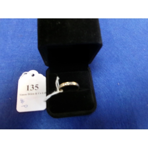 135 - An 18 carat gold half loup ring (size P)