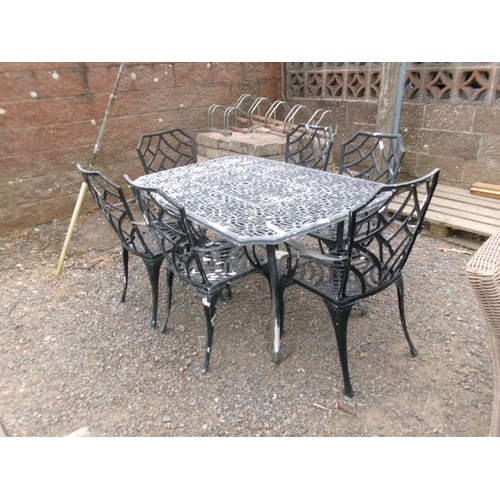 20 - A rectangular pierced aluminium garden table together with six matching chairs