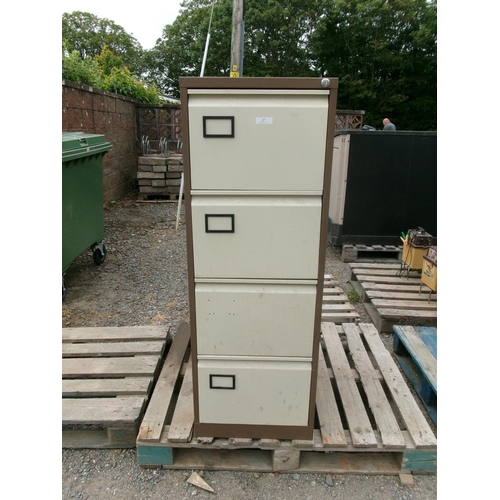 27 - A four drawer metallic filing cabinet