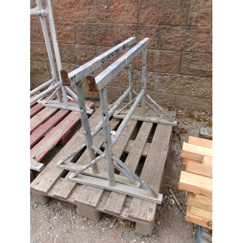 29 - A pair of adjustable galvanised building trestles