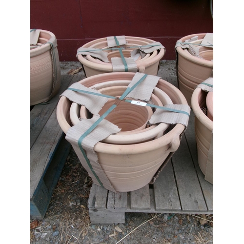 65 - Two graduated sets of four terracotta planters - new