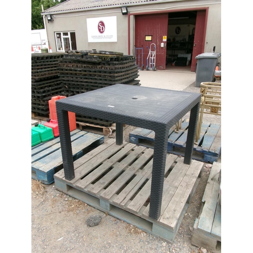 90 - A black PVC patio table