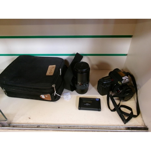 186 - A Yashica camera, lens, bag and accessories