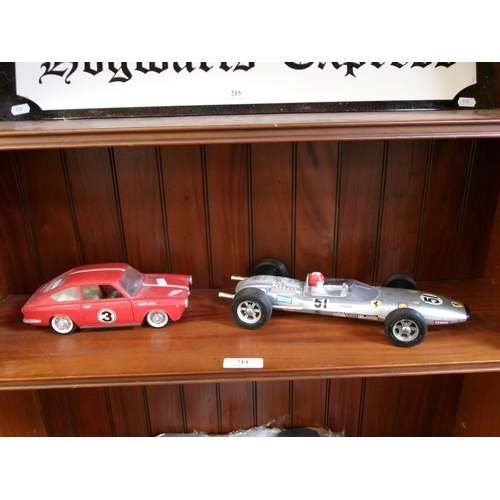 214 - A model of a Seat R26 coupe together with a tin plate model of a racing car