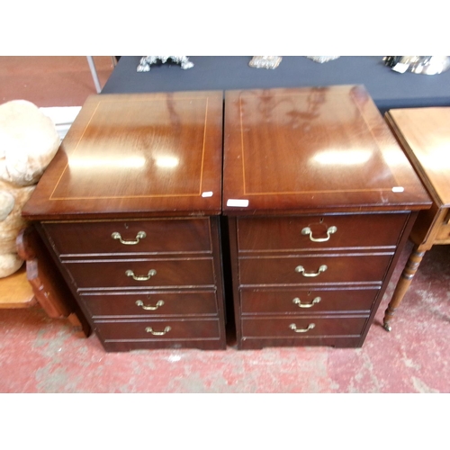 284 - A pair of mahogany two drawer filing cabinets modelled as chests of four drawers