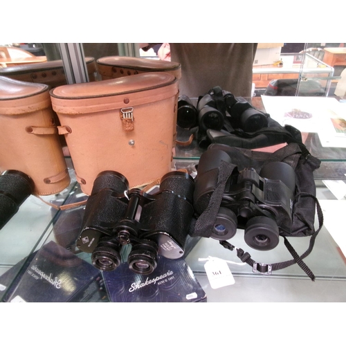 361 - A pair of 8-24x50 binoculars together with a pair of 16x50 binoculars and case