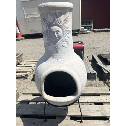 65 - A terracotta chiminea on metallic stand