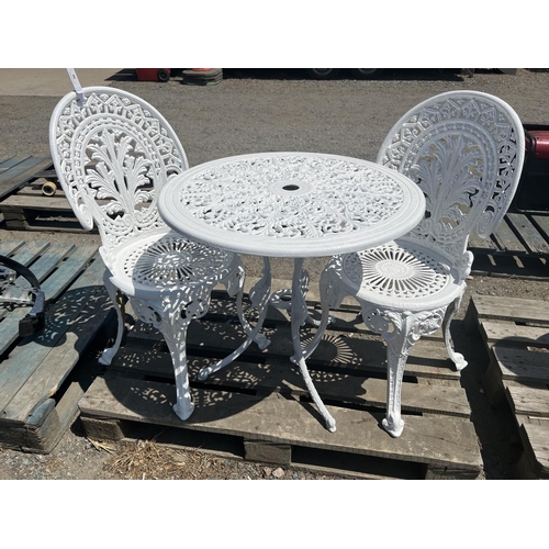 66 - A pierced aluminium garden table together with two matching chairs