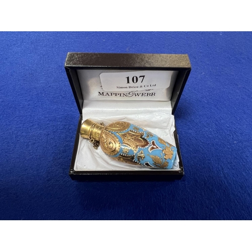 107 - A turn of the twentieth century turquoise perfume bottle with gold leaf decoration and fitted with o... 