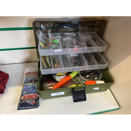 149 - A cantilever tackle box containing a large assortment of fishing tackle