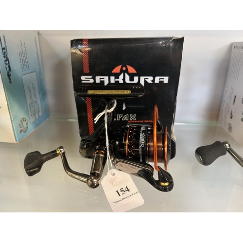 154 - A Sakura Alpax fixed spool fishing reel - new and boxed