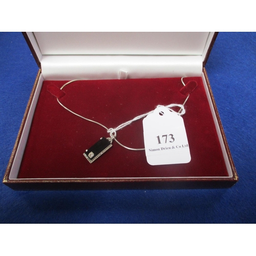 173 - A jet pendant set with a diamond on chain and modelled in the Art Deco style