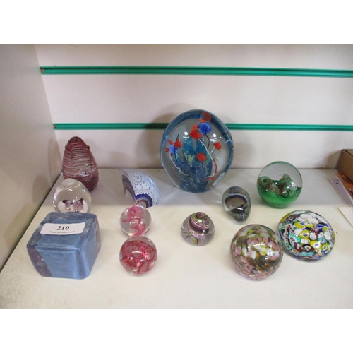 210 - A collection of glass paper weights