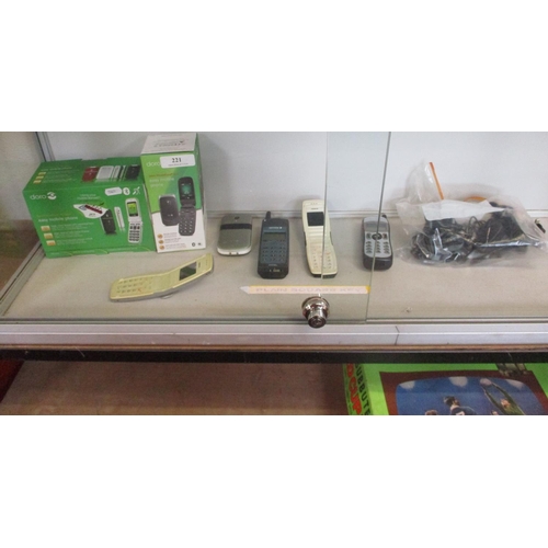 221 - A selection of early mobile telephones and accessories