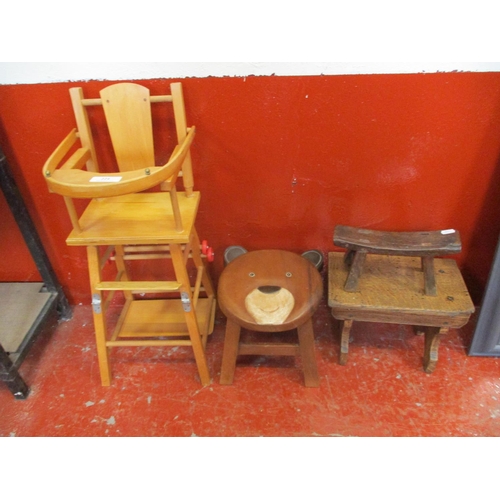 224 - A nineteenth century wooden head rest, a milking stool and one other together with a mid century dol... 