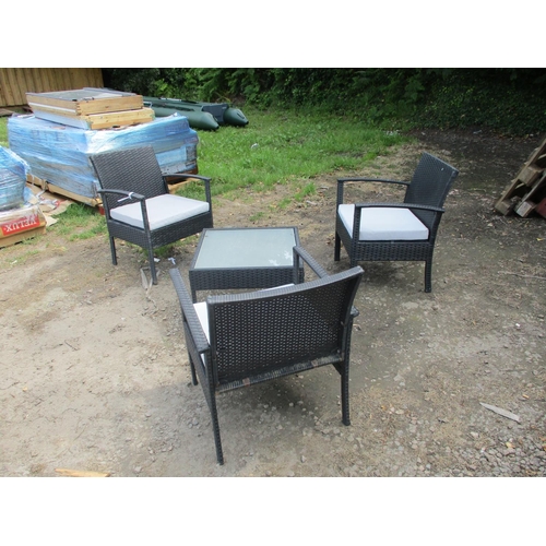 27 - A set of three all weather rattan patio chairs and matching table