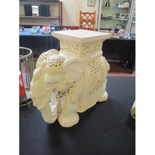 269 - A salt glazed pottery plant stand modelled in the form of a ceremonial Indian elephant