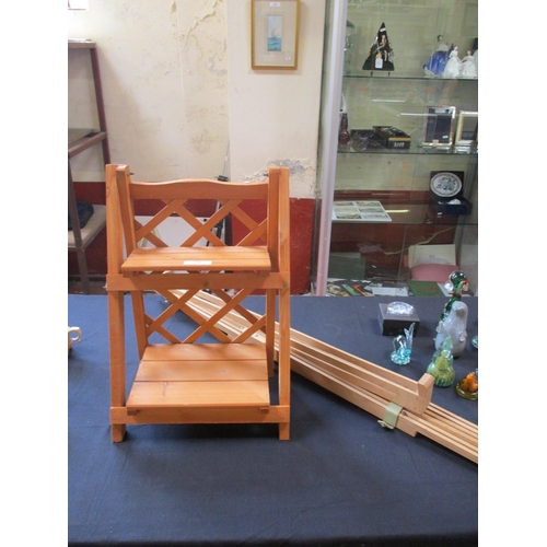 305 - A beech artist's easel together with a folding wooden seat of diminutive form