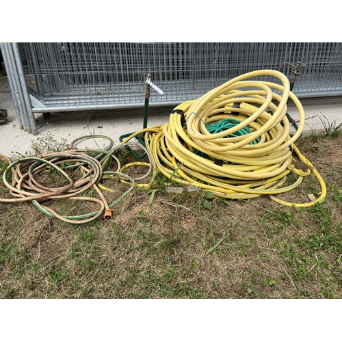 15 - Several lengths of hosepipe together with two irrigation sprinklers