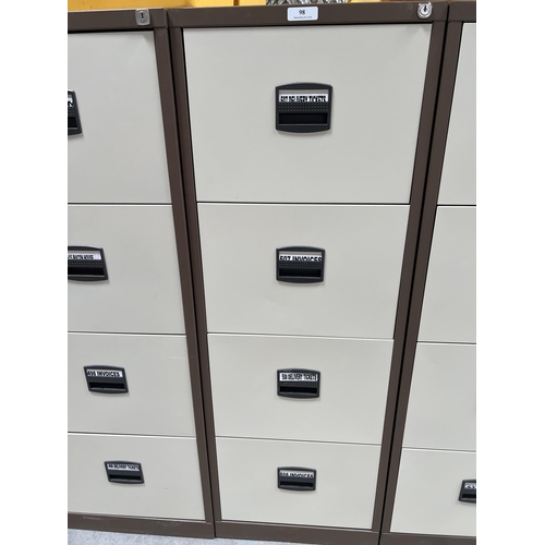 98 - A four drawer metallic filing cabinet