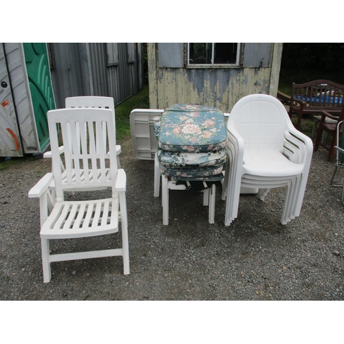 22 - A range of white PVC garden furniture complete with cushions and parasol