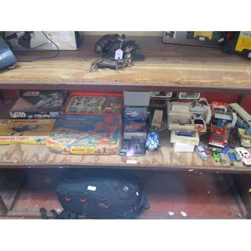 415 - An accumulation of diecast model vehicles, various games, model kits etc.