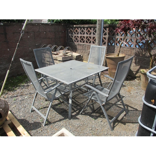 34 - An aluminium garden table together with four matching chairs