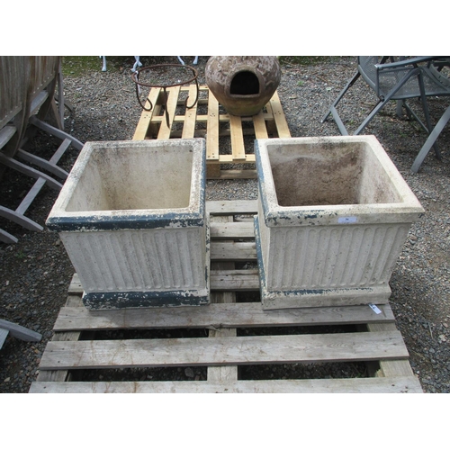 36 - A pair of reconstituted stone square planters with fluted decoration