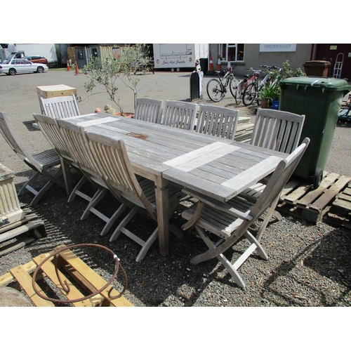 39 - A substantial teak rectangular garden table together with ten matching chairs