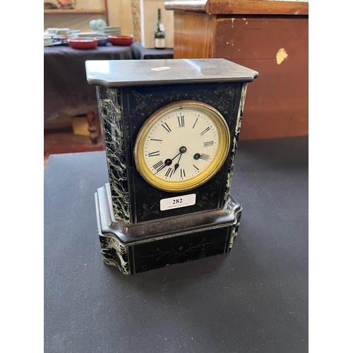 282 - A nineteenth century slate and marble cased mantle clock