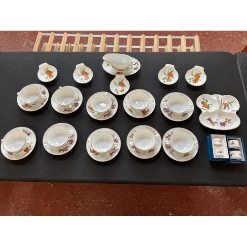 283 - A quantity of Royal Worcester Evesham soup coupes and saucers together with other Evesham items