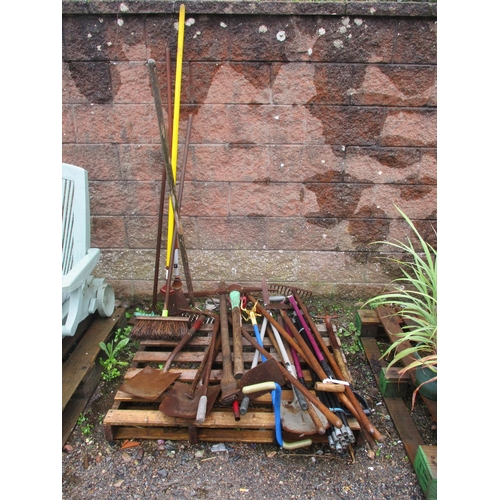 49 - An accumulation of gardening hand tools together with a set of drain rods