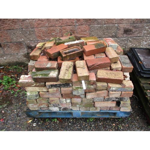 63 - A pallet of reclaimed red bricks