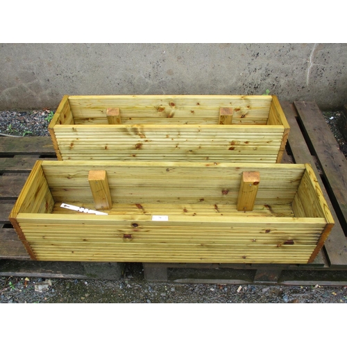 76 - A pair of rectangular tanalised timber planters