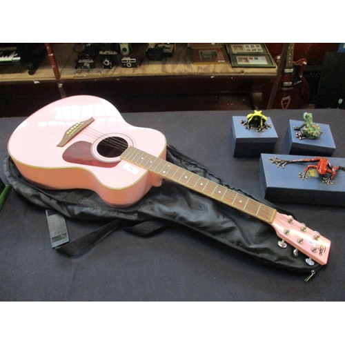 336 - A vintage acoustic guitar finished in pink complete with case