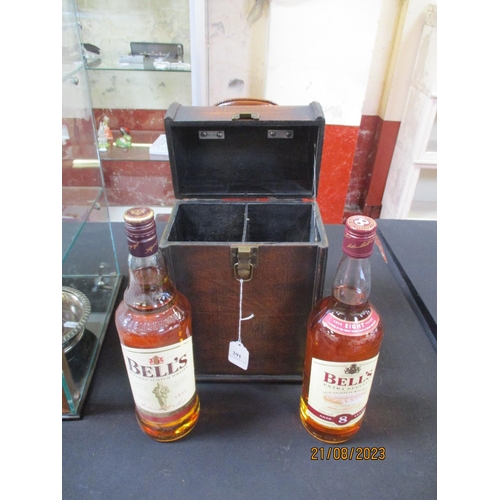 291 - Two 1L bottles of Bell's Scotch Whisky contained within a travelling tantalus