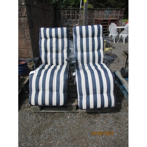 42 - A pair of folding garden chairs, the cushions upholstered  in blue and white striped fabric