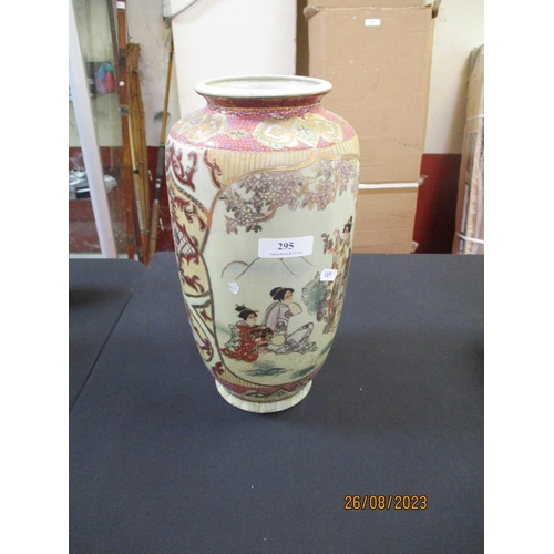 295 - A ceramic vase in the Oriental style with figural decoration