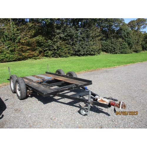 22 - A tandem axle vehicle transporter trailer