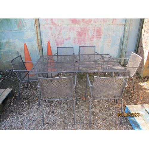 41 - A metallic garden table together with six matching chairs