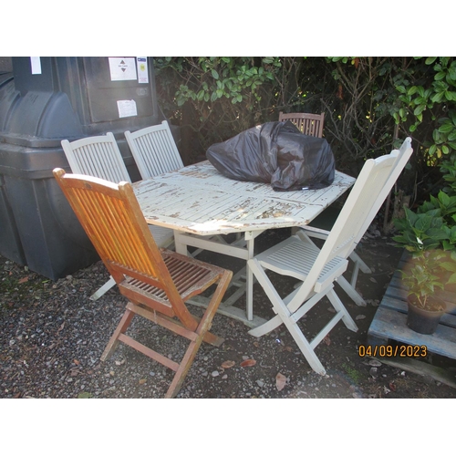 49 - An over painted teak patio table together with six chairs complete with cushions