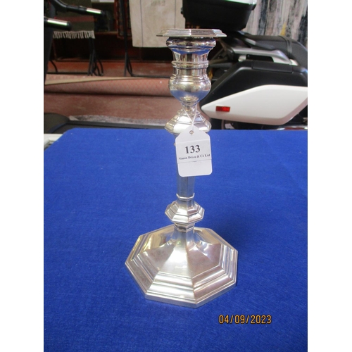 133 - A solid silver candlestick holder by Messrs. Mappin & Webb of London and Sheffield (26cm high)