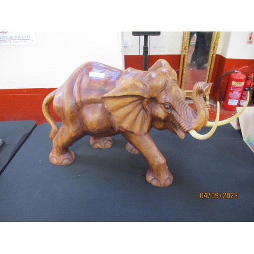 179 - A hardwood carving of a bull elephant of large proportion