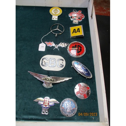 184 - Twelve assorted vintage car grille and bonnet badges